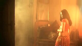 Beautiful Indian flower girl with brown hair, enjoys sensual pleasure in hot scenes.