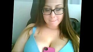 Big tits girl with glasses stripping