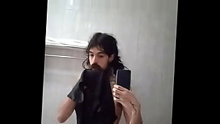 very long bearded femenine guy teasing cock on mirror