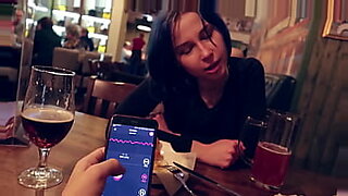 I took control of my stepsister's vibrator in the bar and brought her to orgasm.