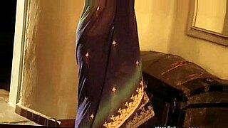 A beautiful Indian woman with a charming smile poses naked and exposes her charms.