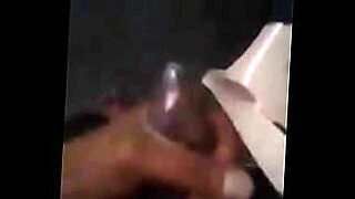 Gay guy masturbates with a condom on his cock.
