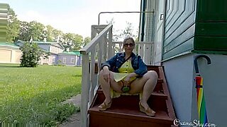 Buttpluged slut in a nature park