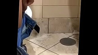 An Indian man masturbates with his big cock in the bathroom.