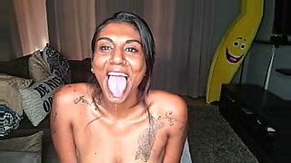 Desi drools while playing with her tongue.