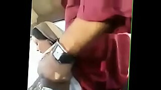 Hot girl gives a blowjob in a car.