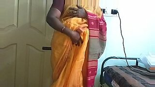 Indian wife Vanitha in orange, showing her big boobs.