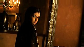 Beautiful Asian woman stripping to hot music.