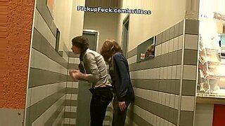 Girl with two braids does blowjob for two guys at the same time