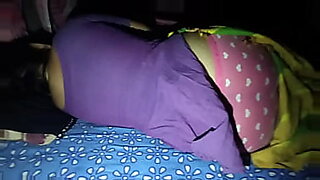Beautiful Indian woman sleeping on her stomach.