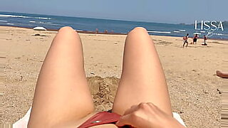 stranger fills my mouth on public beach