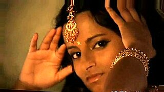 Pretty and innocent looking girls pose and strip in this softcore erotic India themed video.
