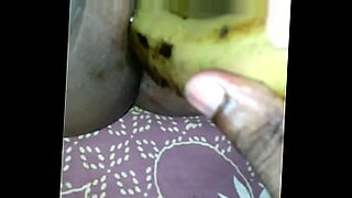 Tamil cutie enjoys playing with banana.