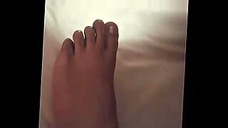 Indian beauty gives a foot job to a white man.