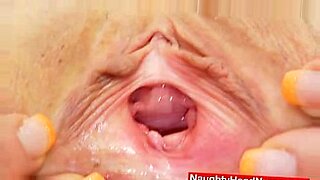 Milada, the hot mama nurse, examines her pink cooter with a latex cock